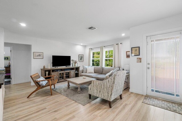 1222 N Palmway, Lake Worth Beach, FL 33460 - living room with light wood-type flooring and recessed lighting