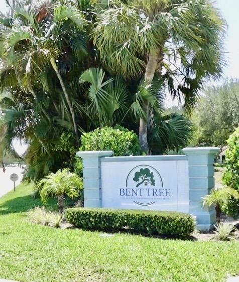 9740 Pecan Tree Dr Unit A, Boynton Beach, FL 33436 - community / neighborhood sign featuring a lawn