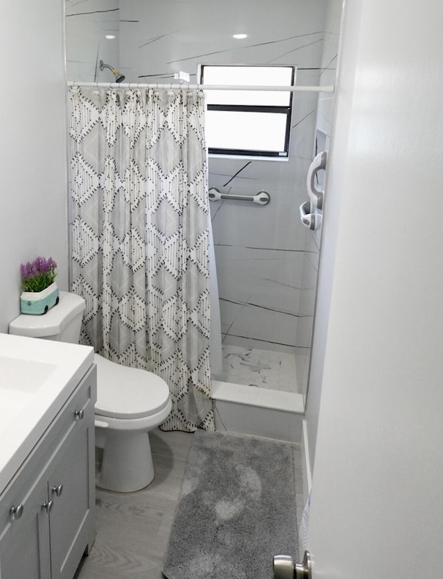 9740 Pecan Tree Dr Unit A, Boynton Beach, FL 33436 - bathroom with toilet, vanity, and a stall shower