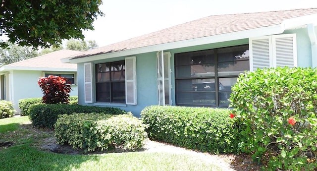 9740 Pecan Tree Dr Unit A, Boynton Beach, FL 33436 - entrance to property featuring stucco siding and a shingled roof
