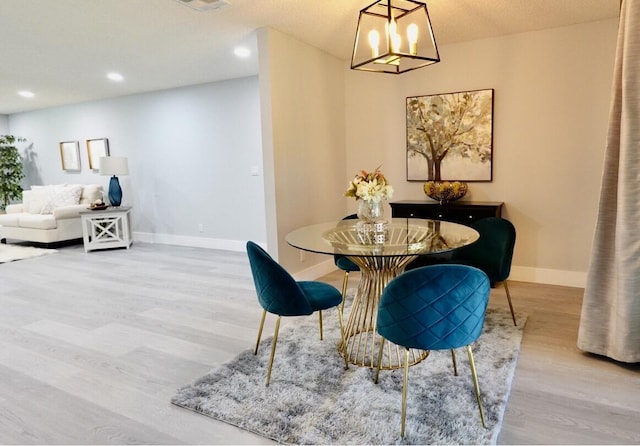 9740 Pecan Tree Dr Unit A, Boynton Beach, FL 33436 - dining room with wood finished floors, baseboards, a chandelier, and recessed lighting