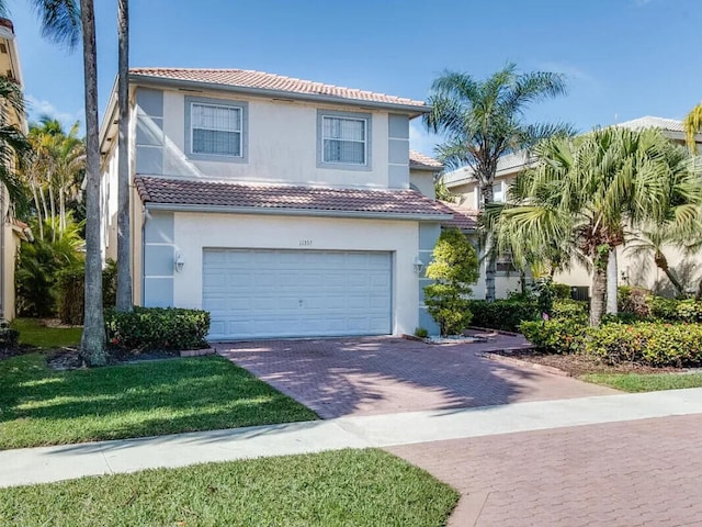 11353 Sea Grass Cir, Boca Raton, FL 33498 - view of front facade featuring a tile roof, stucco siding, decorative driveway, and a garage