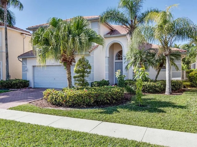 11353 Sea Grass Cir, Boca Raton, FL 33498 - mediterranean / spanish house with a tile roof, stucco siding, and a front lawn