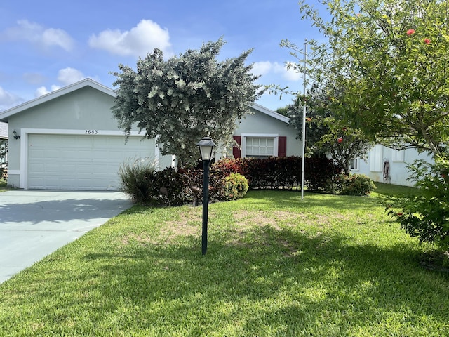 2683 SW Marquis Ter, Stuart, FL 34997 - view of front facade with stucco siding, driveway, a front yard, and a garage