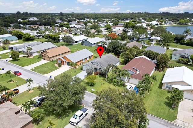 2683 SW Marquis Ter, Stuart, FL 34997 - aerial perspective of suburban area featuring a nearby body of water