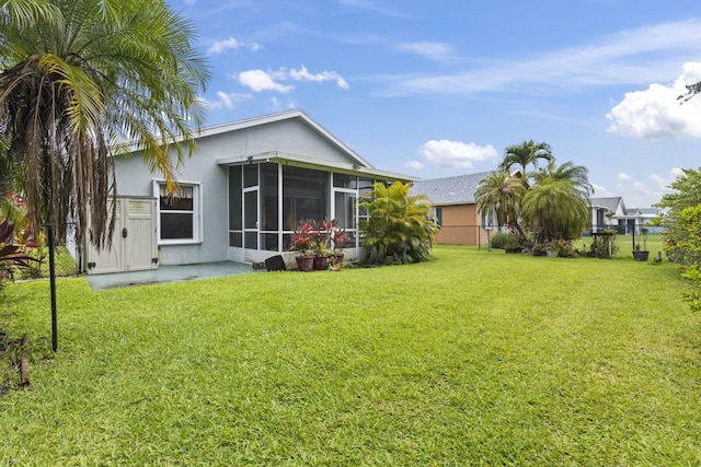 2683 SW Marquis Ter, Stuart, FL 34997 - back of property with a sunroom and stucco siding