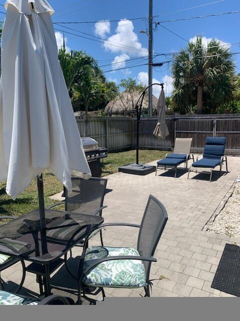 723 N Federal Hwy, Lake Worth Beach, FL 33460 - fenced backyard with a patio and area for grilling