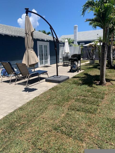 723 N Federal Hwy, Lake Worth Beach, FL 33460 - view of yard with french doors and a patio