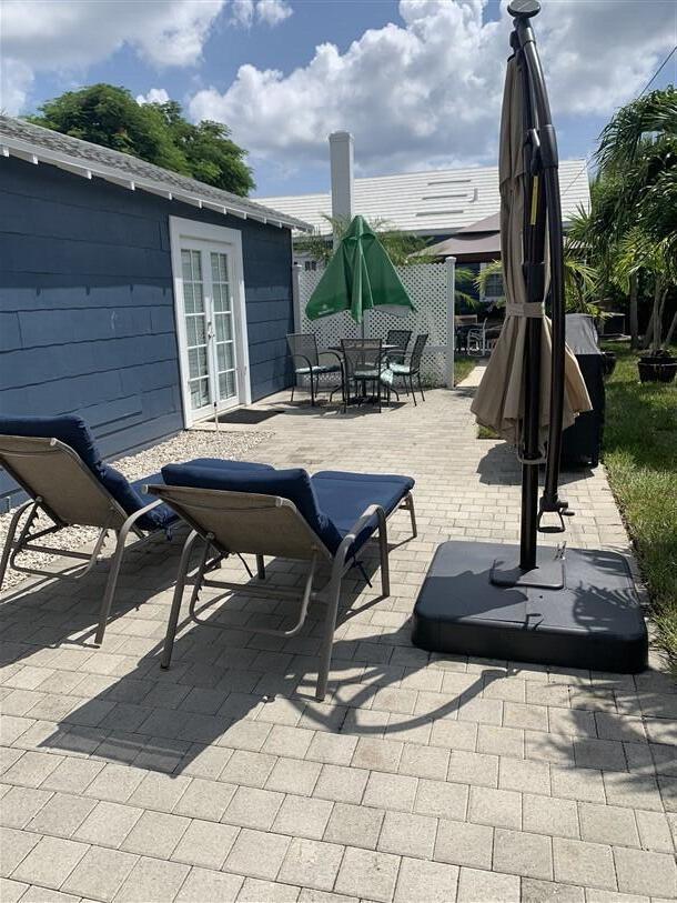 723 N Federal Hwy, Lake Worth Beach, FL 33460 - view of patio with french doors, outdoor dining area, and a gazebo