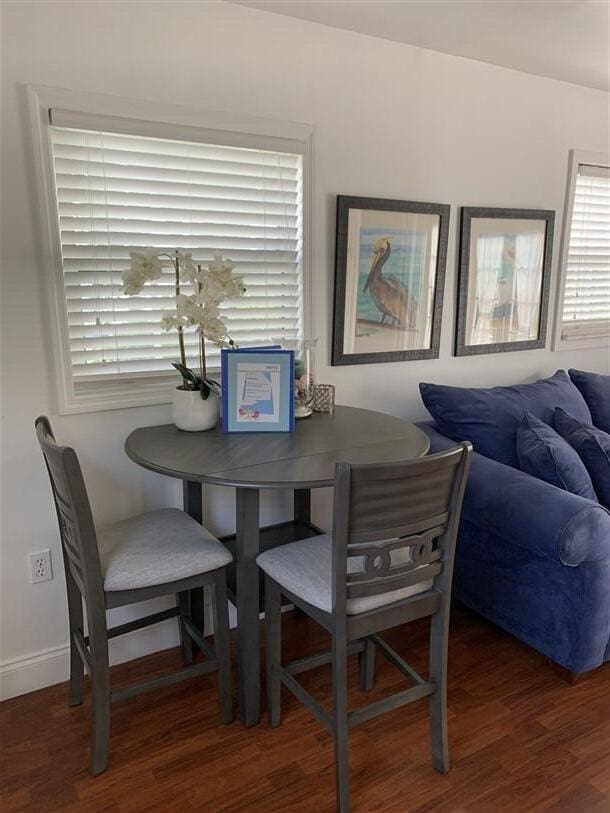 723 N Federal Hwy, Lake Worth Beach, FL 33460 - dining space featuring wood finished floors, healthy amount of natural light, and baseboards