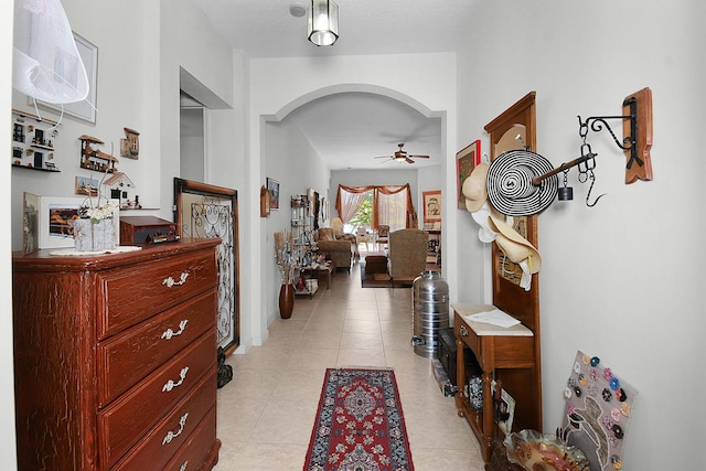 107 NW Summerville Ct, Port Saint Lucie, FL 34986 - foyer featuring a ceiling fan, arched walkways, and light tile patterned floors