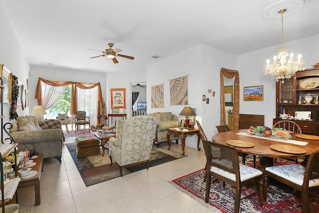 107 NW Summerville Ct, Port Saint Lucie, FL 34986 - dining room featuring ceiling fan, a chandelier, and light tile patterned floors