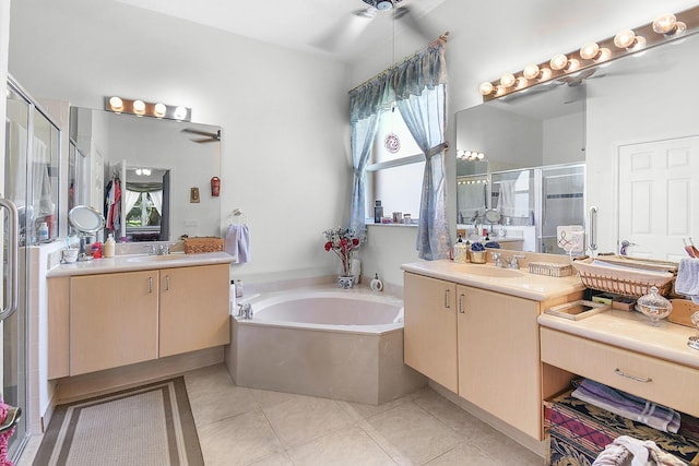 107 NW Summerville Ct, Port Saint Lucie, FL 34986 - bathroom featuring ceiling fan, healthy amount of natural light, a shower stall, and two vanities