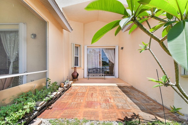 107 NW Summerville Ct, Port Saint Lucie, FL 34986 - entrance to property featuring stucco siding and a patio