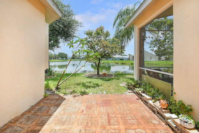 107 NW Summerville Ct, Port Saint Lucie, FL 34986 - view of patio with a water view