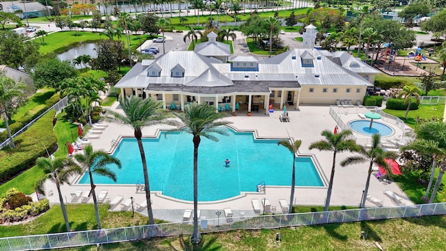 107 NW Summerville Ct, Port Saint Lucie, FL 34986 - community pool featuring a patio and a hot tub