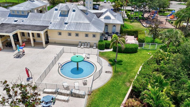107 NW Summerville Ct, Port Saint Lucie, FL 34986 - aerial view of property and surrounding area with a pool area