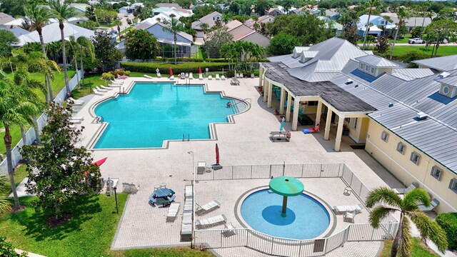 107 NW Summerville Ct, Port Saint Lucie, FL 34986 - community pool with a patio area and a residential view