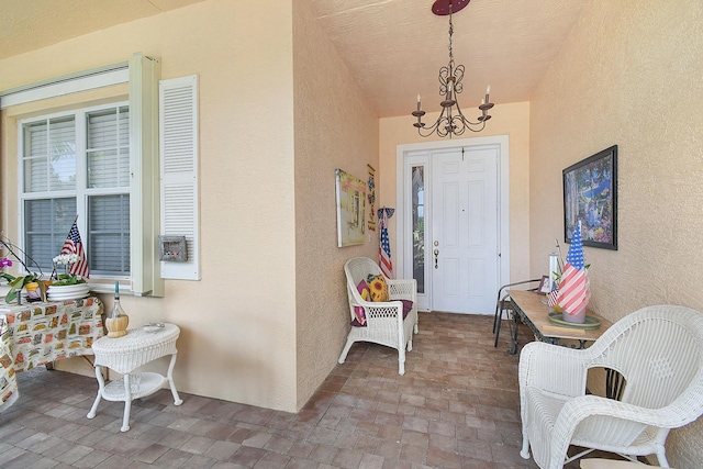 107 NW Summerville Ct, Port Saint Lucie, FL 34986 - view of exterior entry with stucco siding and covered porch
