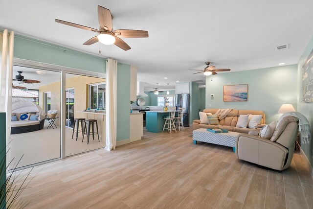 4575 SW Bimini Cir S, Palm City, FL 34990 - living area with ceiling fan, light wood-type flooring, and recessed lighting
