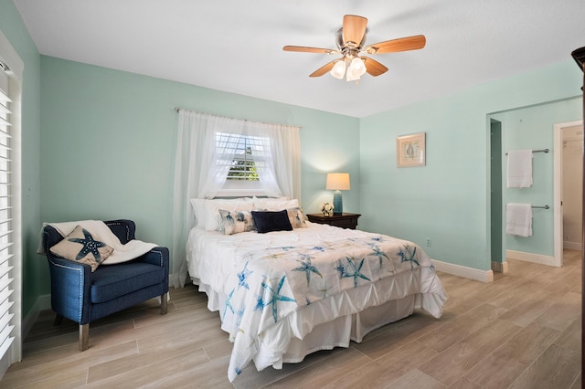 4575 SW Bimini Cir S, Palm City, FL 34990 - bedroom with light wood-style floors and ceiling fan