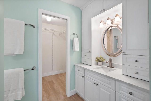4575 SW Bimini Cir S, Palm City, FL 34990 - bathroom with vanity, wood finished floors, and a spacious closet