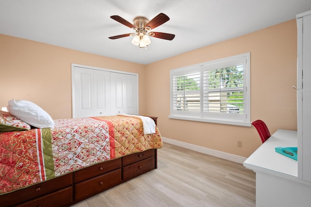 4575 SW Bimini Cir S, Palm City, FL 34990 - bedroom featuring a closet, light wood finished floors, and a ceiling fan
