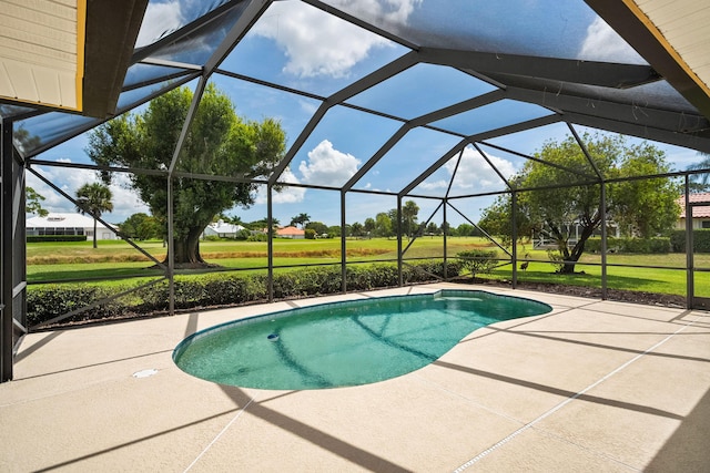4575 SW Bimini Cir S, Palm City, FL 34990 - outdoor pool with a patio area, a lawn, and a lanai