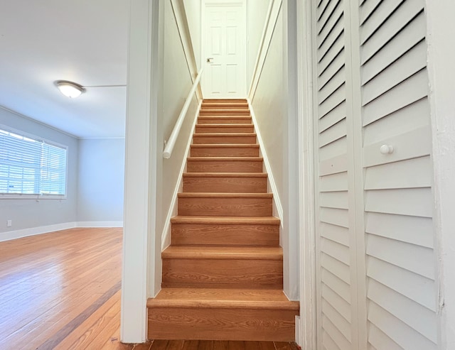 307 4th St, Lake Park, FL 33403 - stairs with wood finished floors and baseboards