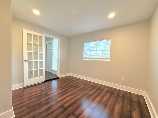 307 4th St, Lake Park, FL 33403 - unfurnished room featuring dark wood finished floors, baseboards, and recessed lighting