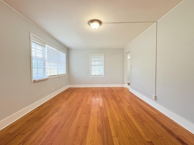307 4th St, Lake Park, FL 33403 - unfurnished room featuring light wood-style flooring, baseboards, and crown molding