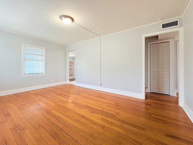 307 4th St, Lake Park, FL 33403 - empty room featuring light wood-style flooring and baseboards