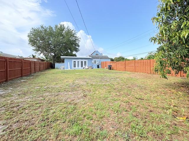 307 4th St, Lake Park, FL 33403 - back of house with french doors