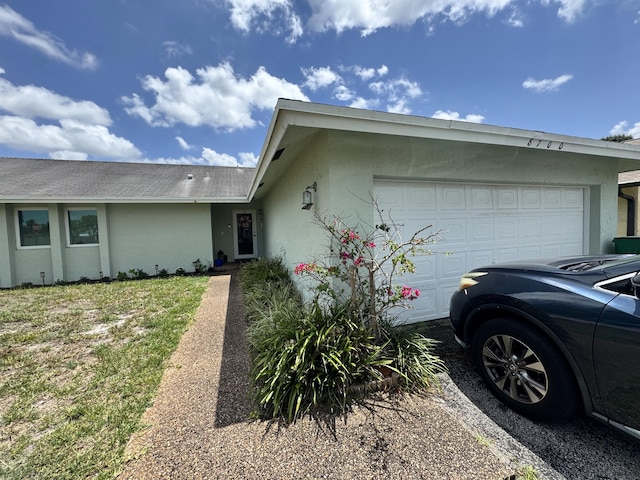 8700 NW 46th Ct, Lauderhill, FL 33351 - view of front facade with an attached garage and stucco siding