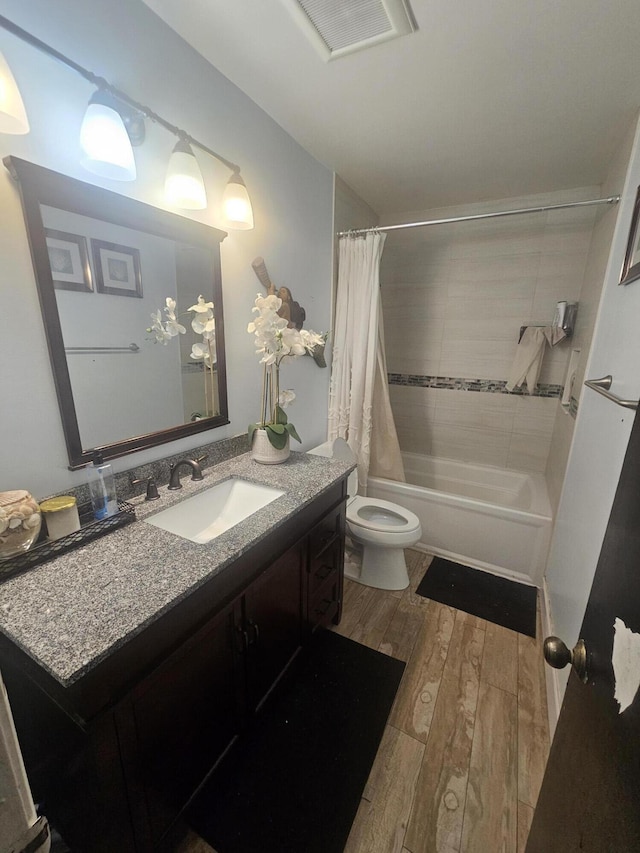 8700 NW 46th Ct, Lauderhill, FL 33351 - full bath featuring shower / bath combo, vanity, wood finished floors, and toilet