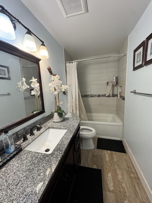 8700 NW 46th Ct, Lauderhill, FL 33351 - bathroom featuring vanity, shower / bath combo with shower curtain, wood finished floors, and toilet