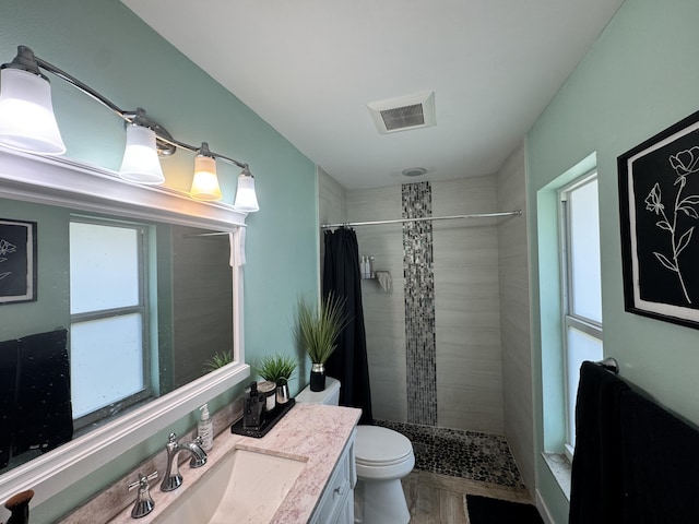 8700 NW 46th Ct, Lauderhill, FL 33351 - bathroom with toilet, vanity, and tiled shower