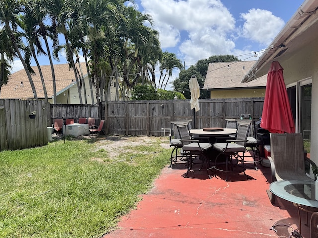 8700 NW 46th Ct, Lauderhill, FL 33351 - view of patio with an outdoor fire pit