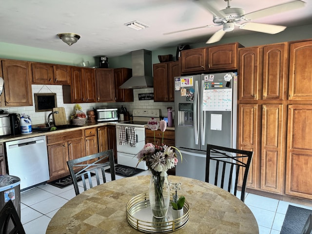 8700 NW 46th Ct, Lauderhill, FL 33351 - kitchen with wall chimney exhaust hood, appliances with stainless steel finishes, a sink, and tasteful backsplash