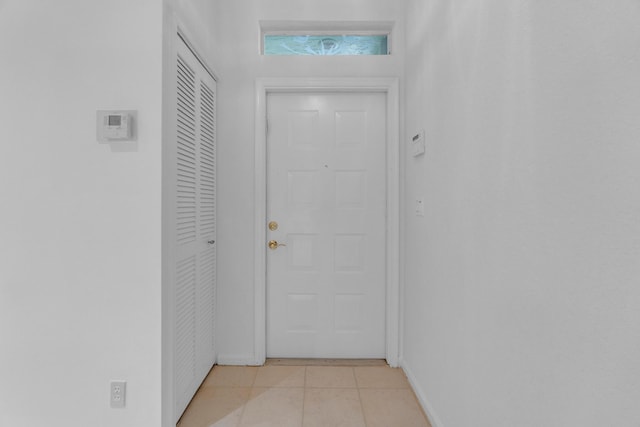 10664 Royal Caribbean Cir, Boynton Beach, FL 33437 - doorway to outside featuring light tile patterned floors and baseboards