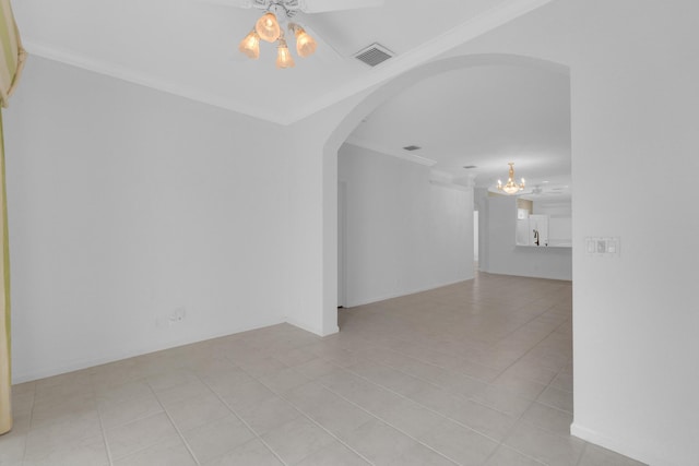10664 Royal Caribbean Cir, Boynton Beach, FL 33437 - empty room with a chandelier, crown molding, arched walkways, light tile patterned floors, and ceiling fan