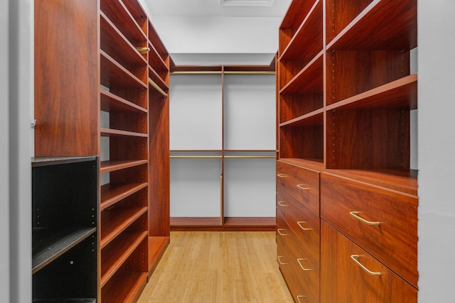 10664 Royal Caribbean Cir, Boynton Beach, FL 33437 - walk in closet with light wood finished floors