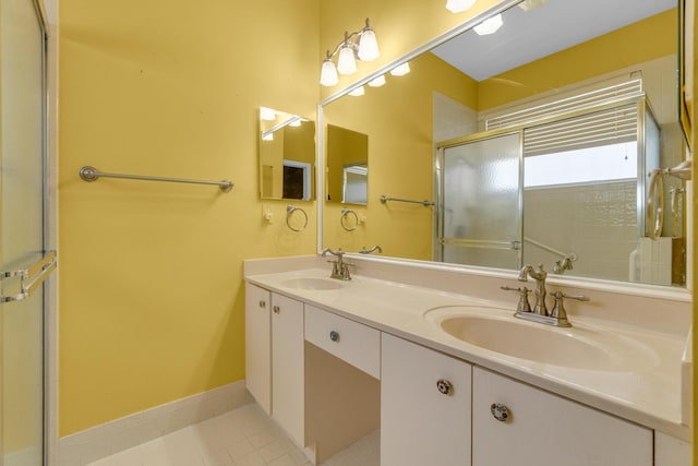 10664 Royal Caribbean Cir, Boynton Beach, FL 33437 - full bath featuring double vanity, a shower with door, tile patterned flooring, and baseboards
