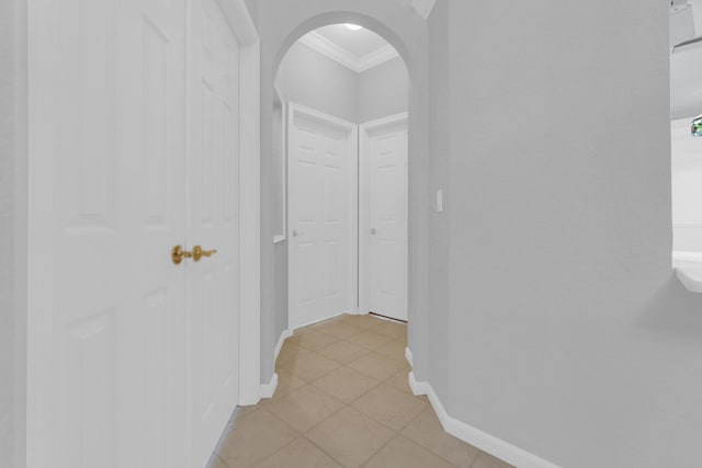 10664 Royal Caribbean Cir, Boynton Beach, FL 33437 - hall with ornamental molding, arched walkways, baseboards, and light tile patterned floors