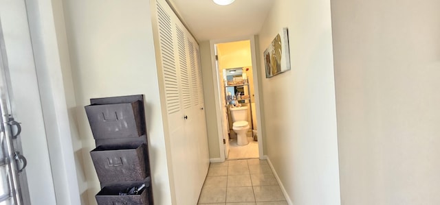 4299 NW 16th St Unit 303, Lauderhill, FL 33313 - corridor featuring light tile patterned flooring and baseboards