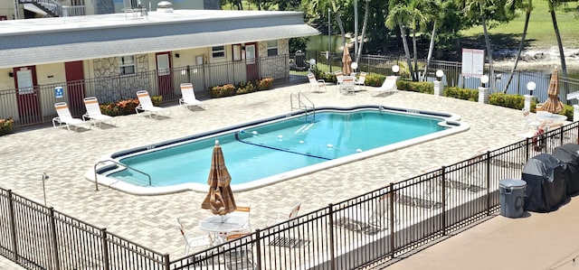 4299 NW 16th St Unit 303, Lauderhill, FL 33313 - community pool featuring a patio area