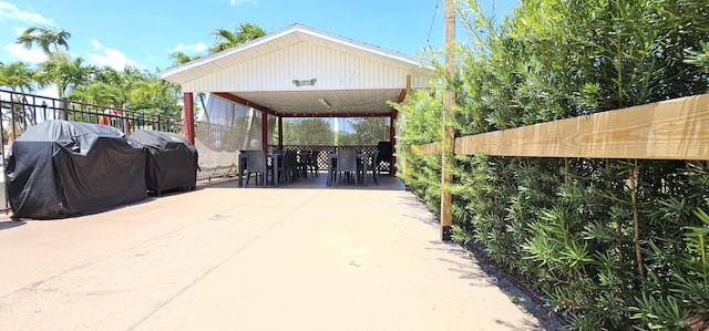 4299 NW 16th St Unit 303, Lauderhill, FL 33313 - view of patio / terrace with area for grilling, concrete driveway, and a detached carport
