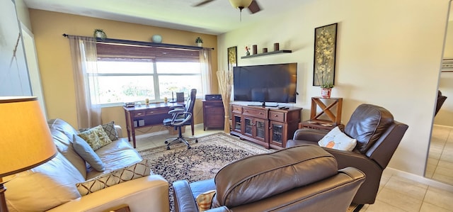 4299 NW 16th St Unit 303, Lauderhill, FL 33313 - tiled living area featuring a ceiling fan and baseboards