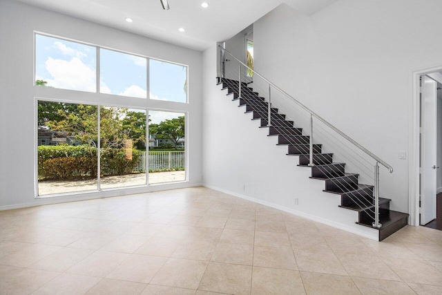 5779 Regency Cir W, Boca Raton, FL 33496 - stairway with a towering ceiling, recessed lighting, baseboards, and tile patterned flooring