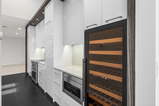 5779 Regency Cir W, Boca Raton, FL 33496 - kitchen with modern cabinets, stainless steel appliances, white cabinetry, wine cooler, and recessed lighting